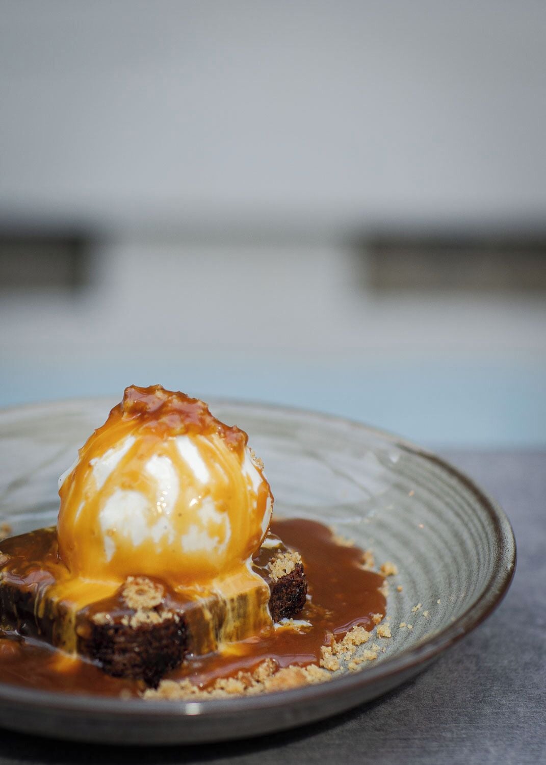A dessert with caramel sauce on a plate.