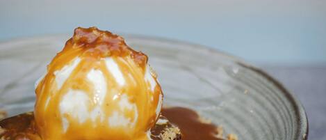 A dessert with caramel sauce on a plate.