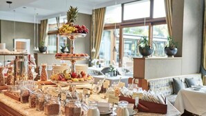 A breakfast buffet with various food items and condiments. - Hotel Deimann (Schmallenberg)