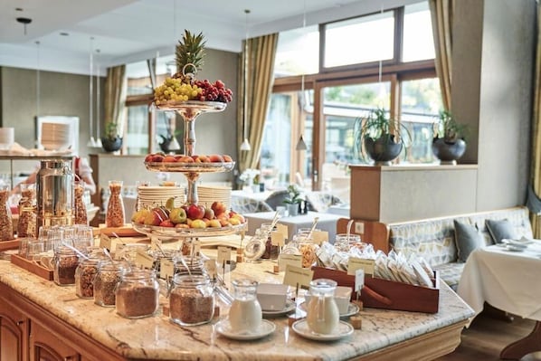 A breakfast buffet with various food items and condiments. - Hotel Deimann (Schmallenberg)