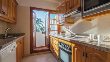 Superior Apartment, 3 Bedrooms, Terrace | Private kitchen | Full-sized fridge, microwave, oven, stovetop