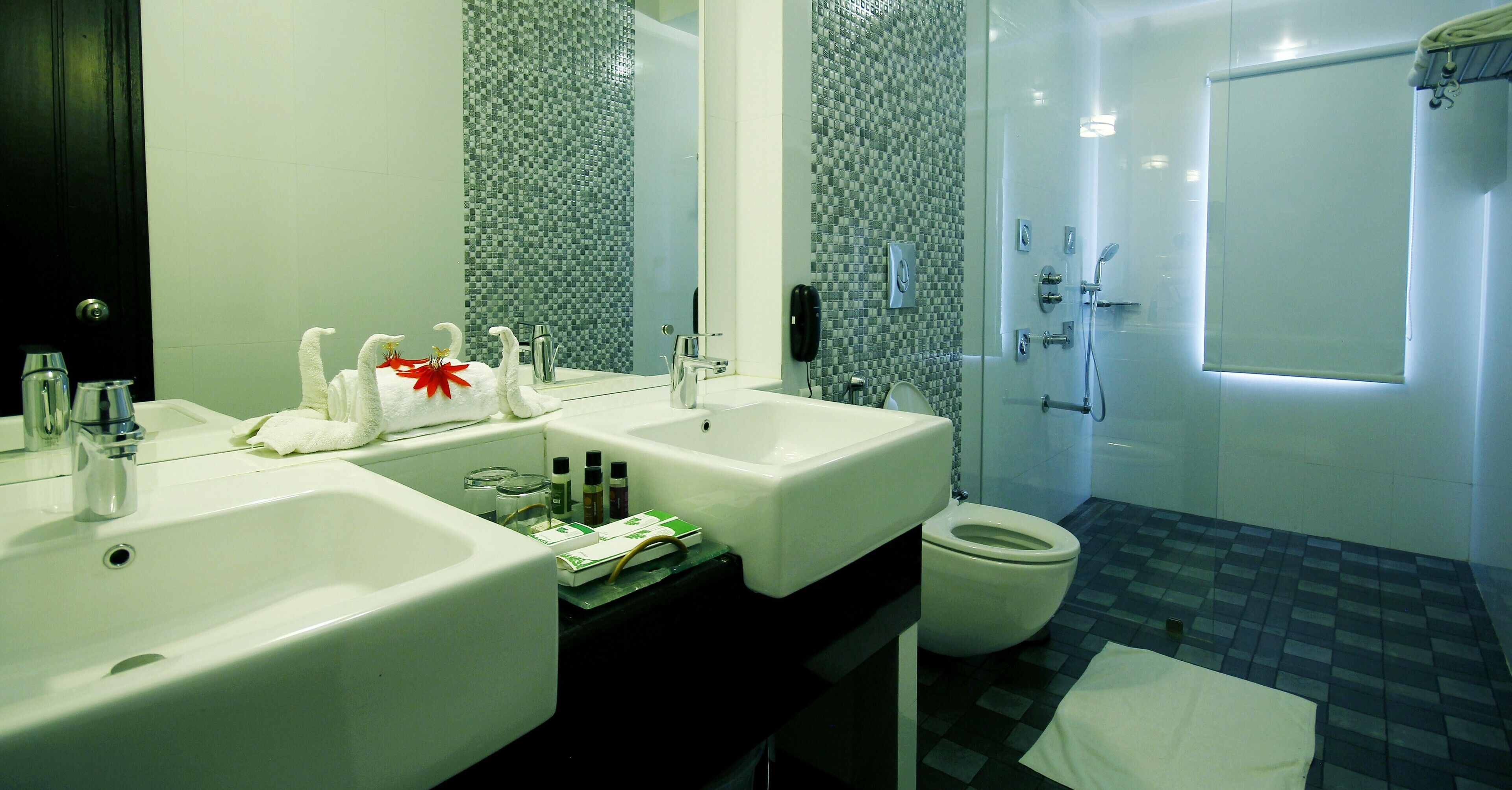 saffron grand | bathroom | hair dryer, bathrobes, towels