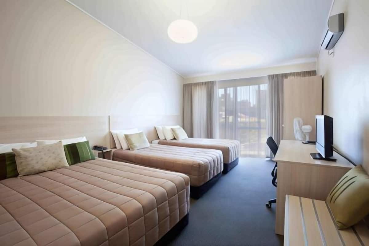 Desk, laptop workspace, blackout curtains, iron/ironing board