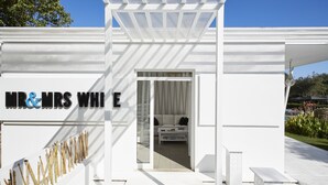 A modern white building with a sign reading "MR & MRS WHI E". - Mr and Mrs White Corfu Couples Retreat Adults Only (Corfu)