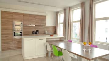 Apartment, 2 Bedrooms | Private kitchen | Full-size fridge, microwave, stovetop, coffee/tea maker