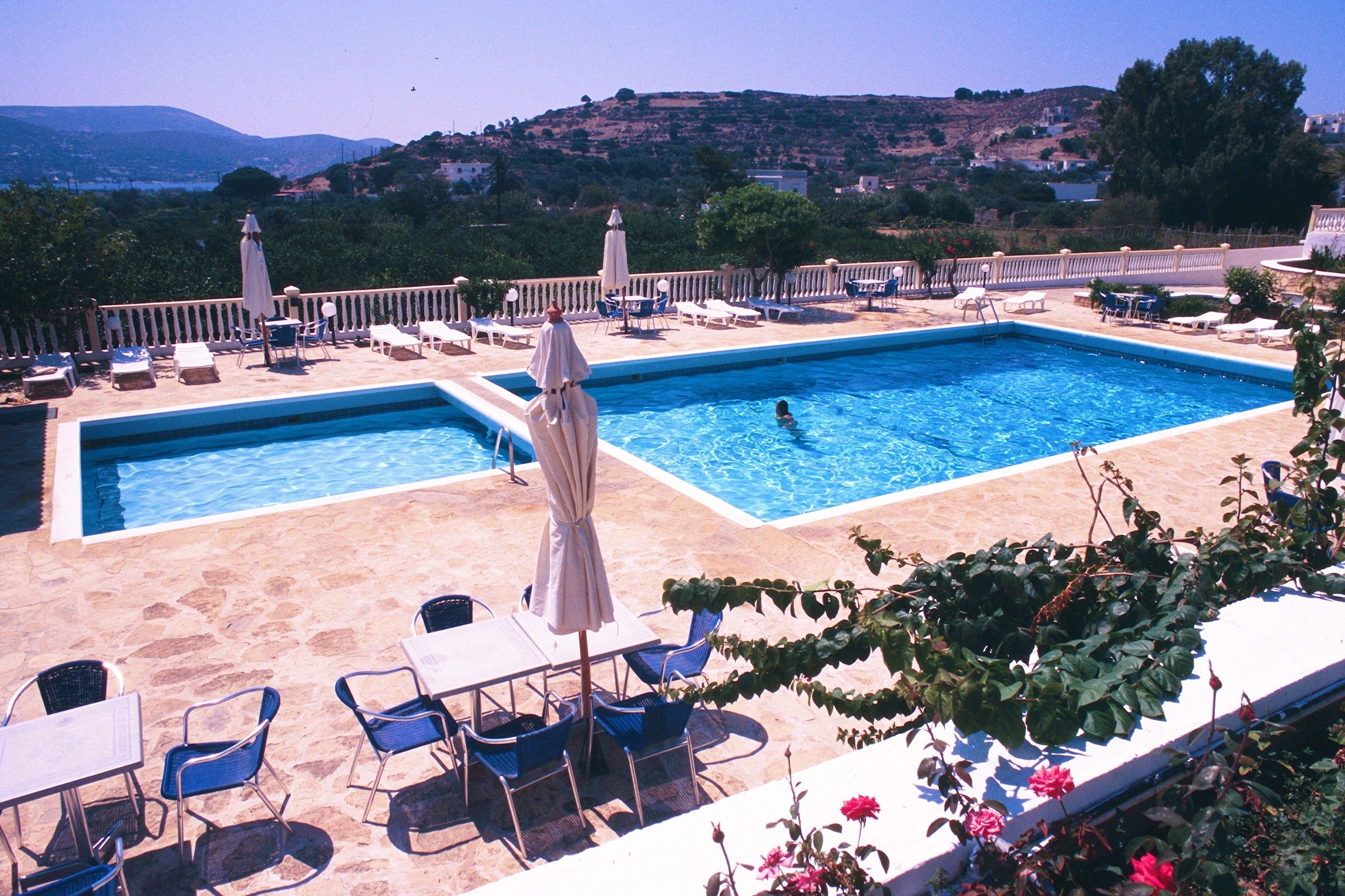 Seasonal outdoor pool, pool umbrellas, pool loungers