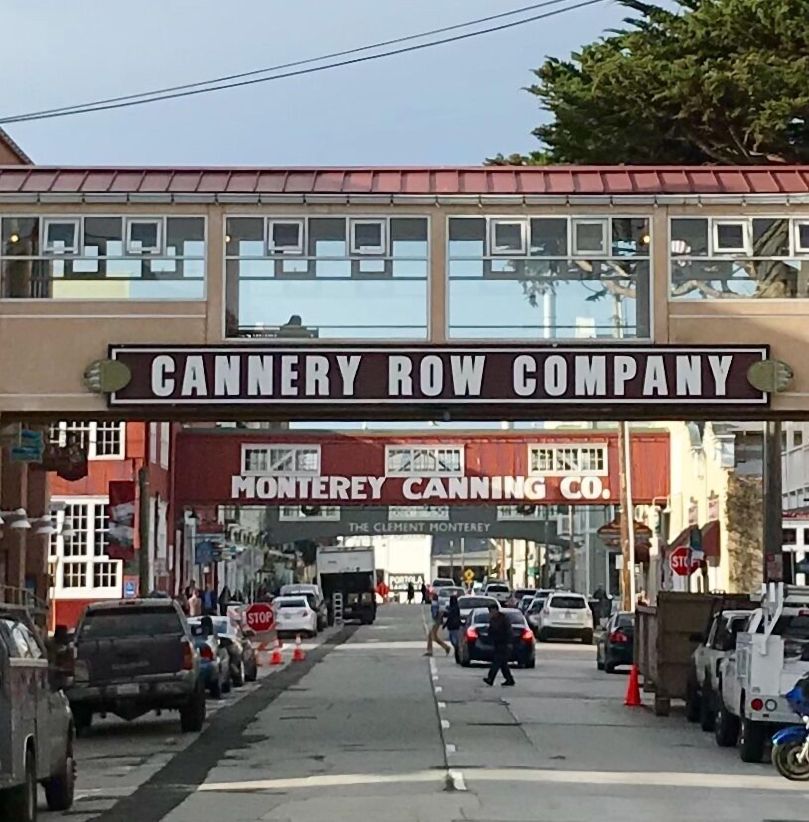 A storefront with a sign reading "CANNERY ROW COMPANY" and "MONTEREY CANNING CO."