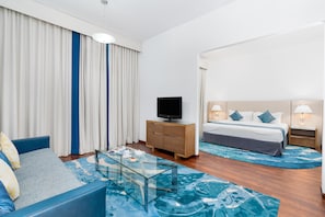 Three Bedroom Premier Suite | Living area | 32-inch flat-screen TV with satellite channels, TV - Golden Sands Hotel & Residences (Sharjah)