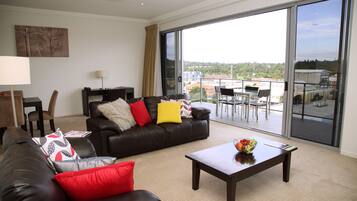 Three Bedroom Penthouse | Living area | 32-inch plasma TV with cable channels, TV