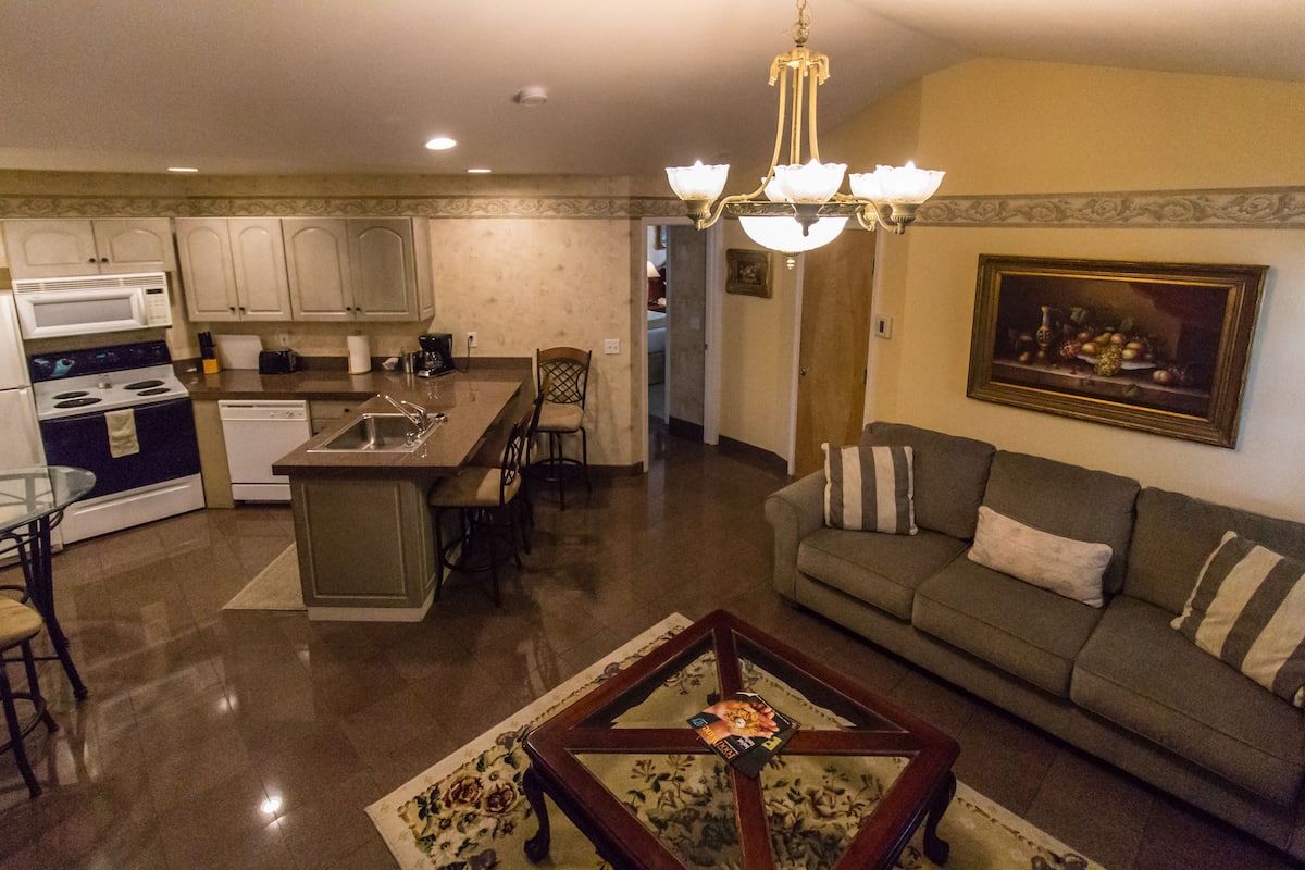 Suite, 2 Queen Beds | Living room | Flat-screen TV, DVD player