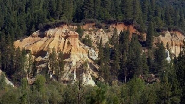 A mountainous landscape with a forested area and a rocky outcrop. - Grass Valley Courtyard Suites (Grass Valley)