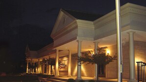 A building with a covered entrance, columns, and a sign that reads "Terrace". - Hampton Inn Burlington (Burlington)