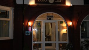 The entrance of a building with a sign reading "Toulson Court." - Toulson Court (Scarborough)