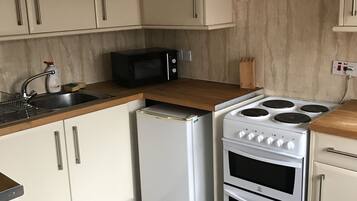 Réfrigérateur dans l'espace commun, micro-ondes dans l'espace commun