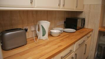 Réfrigérateur dans l'espace commun, micro-ondes dans l'espace commun