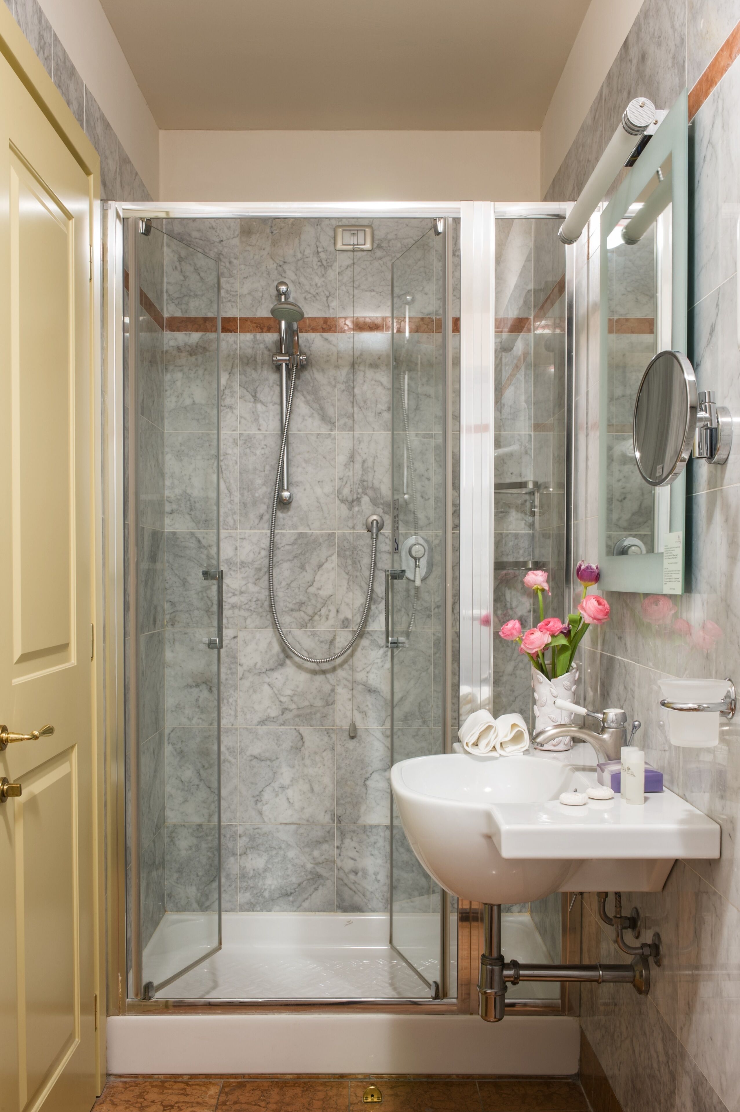 designer toiletries, hair dryer, slippers, bidet