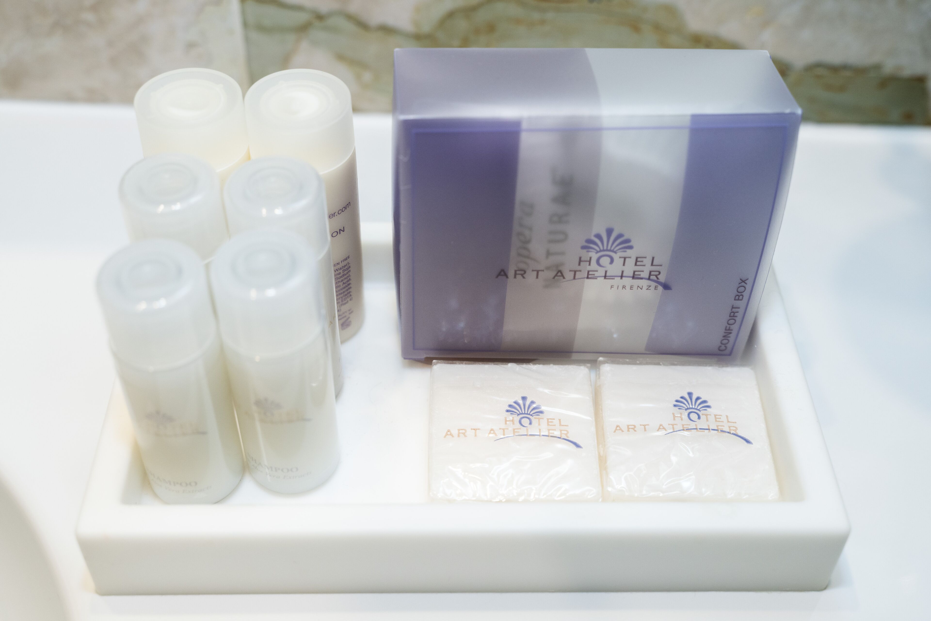 designer toiletries, hair dryer, slippers, bidet