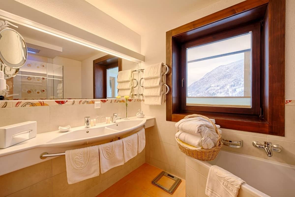 luxury suite, balcony | bathroom | hair dryer, bathrobes, slippers, towels