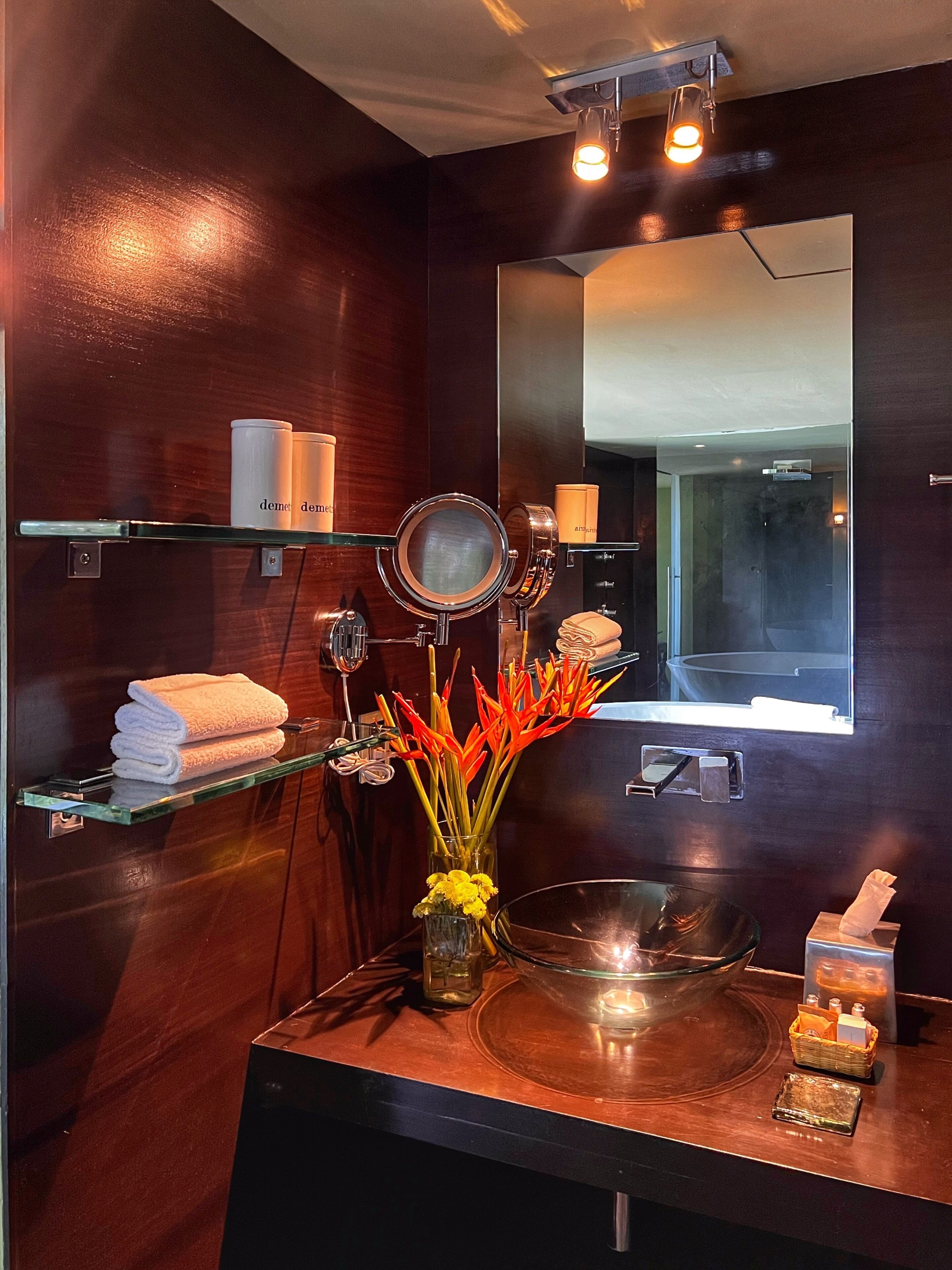 designer toiletries, hair dryer, bathrobes, slippers