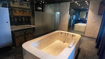 Suite (Principal) | Bathroom | Designer toiletries, hair dryer, bathrobes, slippers