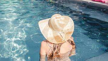 Indoor pool, seasonal outdoor pool, open 8 AM to 8:00 PM, pool umbrellas