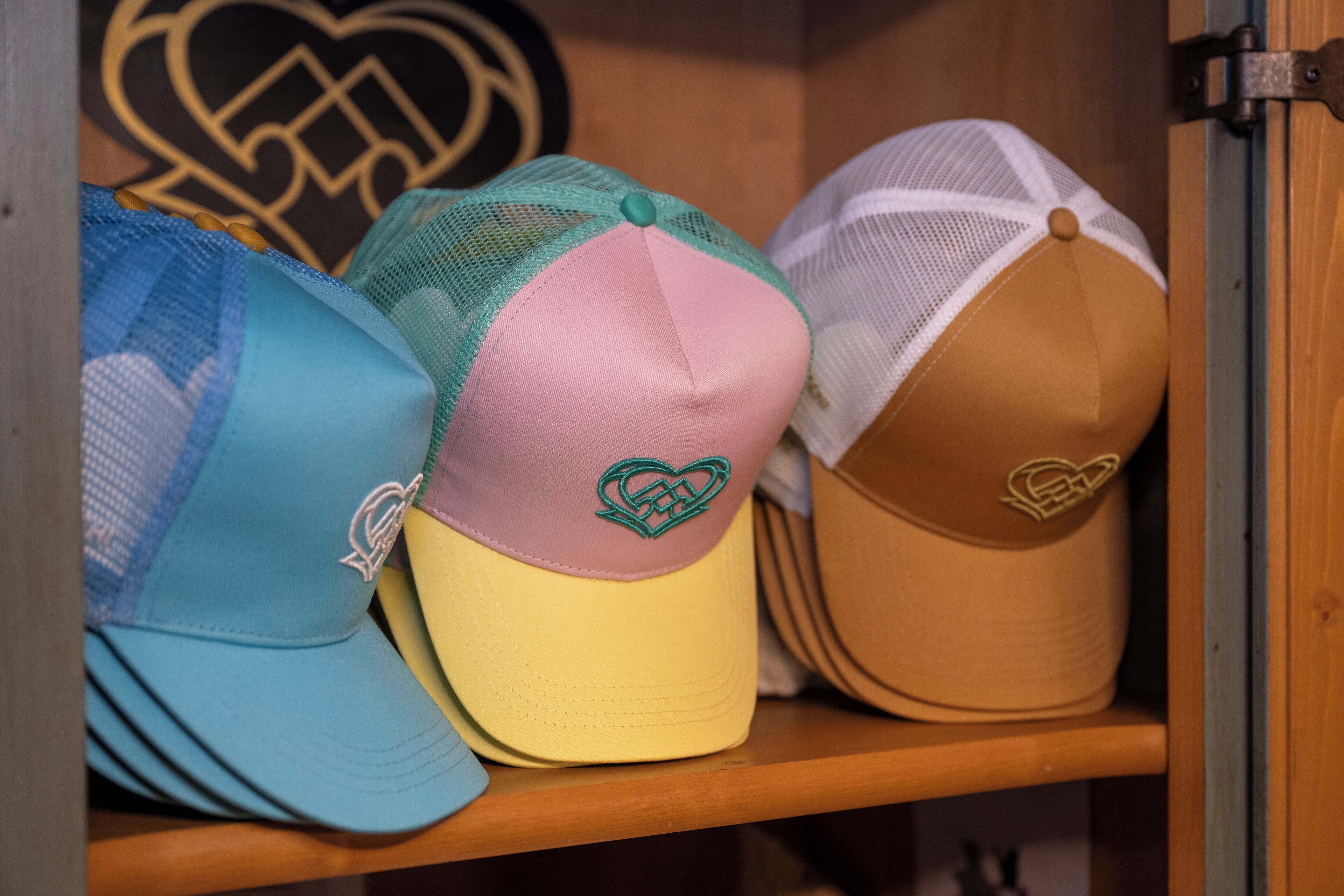 A collection of hats on a shelf.