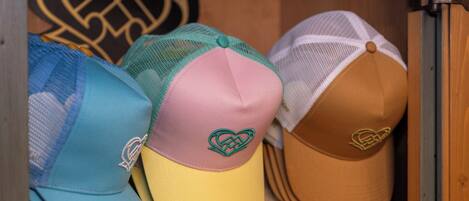A collection of hats on a shelf.