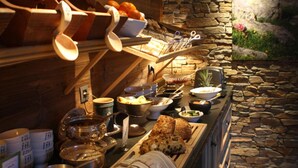 A breakfast buffet with various food items and utensils. - Chalet Hôtel Hermitage - Hotel Chalet de Tradition (Chamonix-Mont-Blanc)