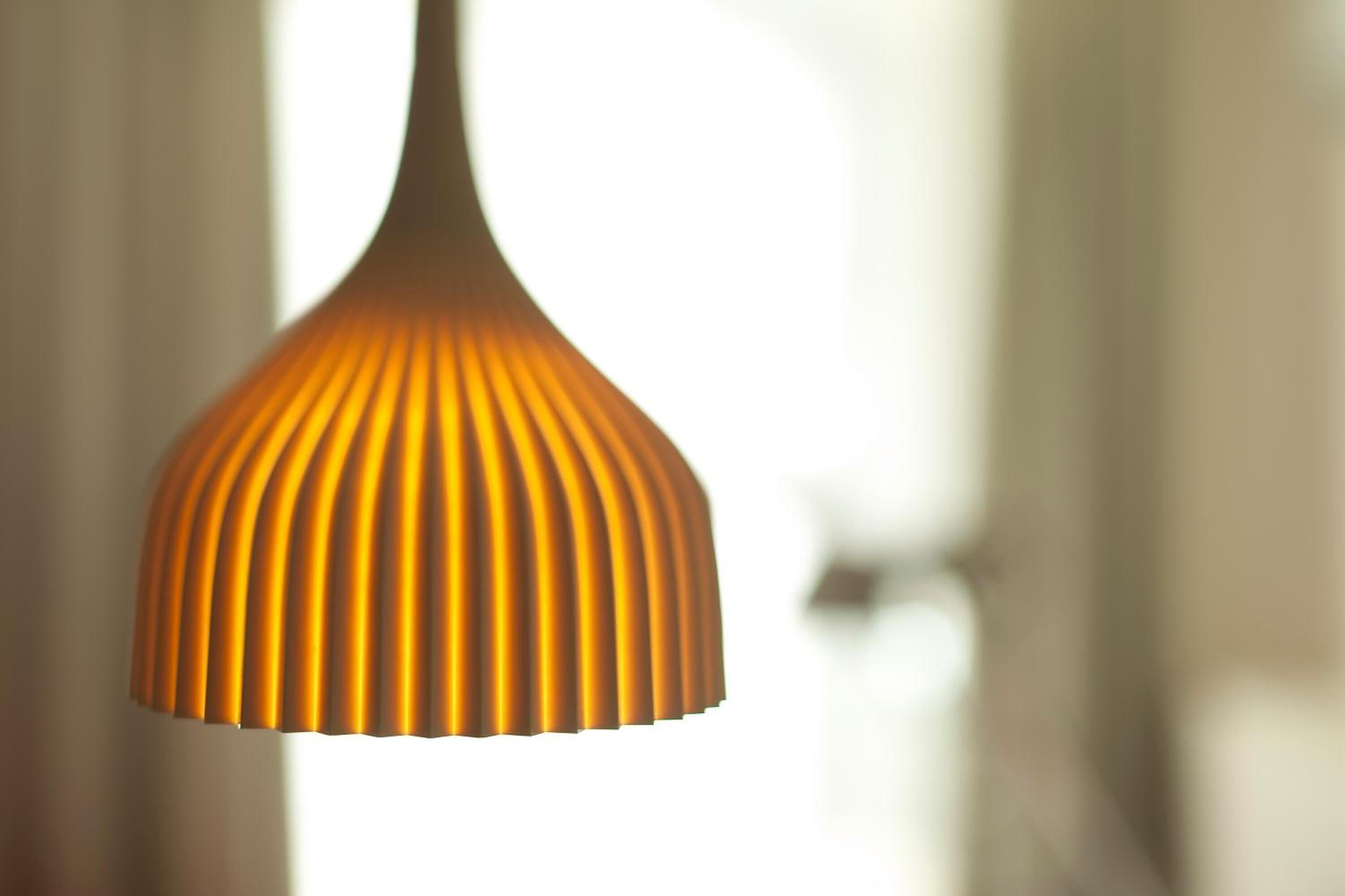 A hanging lamp with a ribbed design.