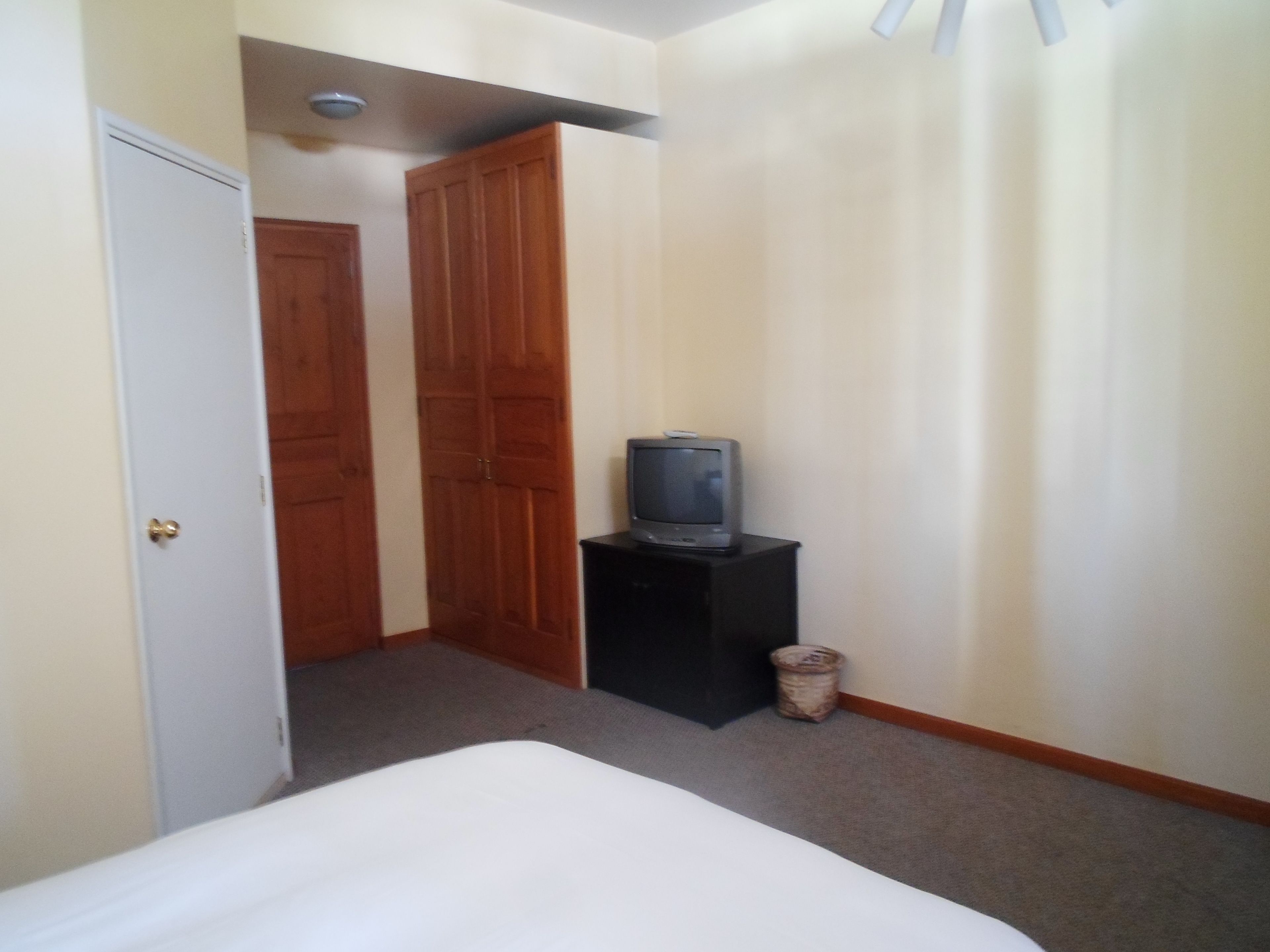 junior suite, 1 queen bed, city view | in-room safe, desk, free wifi