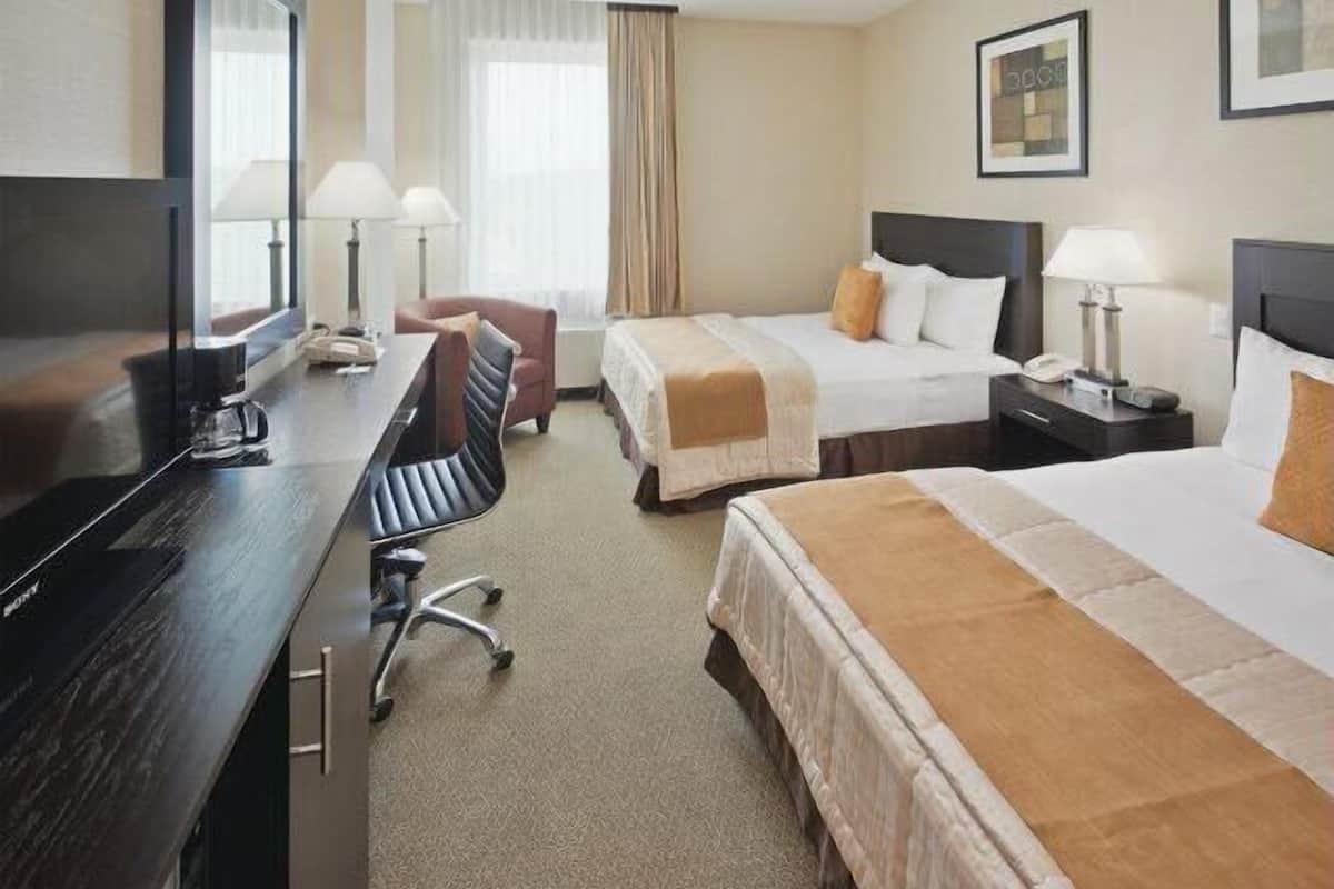 Premium bedding, down comforters, pillowtop beds, in-room safe