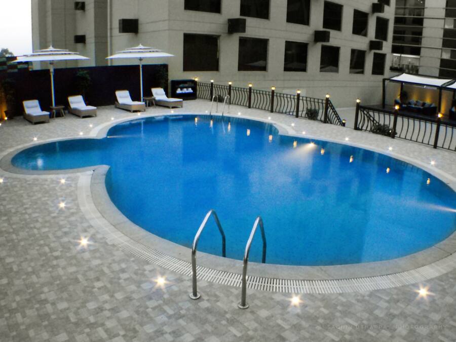 Outdoor pool, pool umbrellas, sun loungers