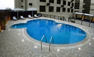 Outdoor pool, pool umbrellas, sun loungers