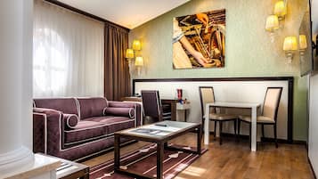 Luxury Suite | Living room | 66-cm plasma TV with digital channels, TV