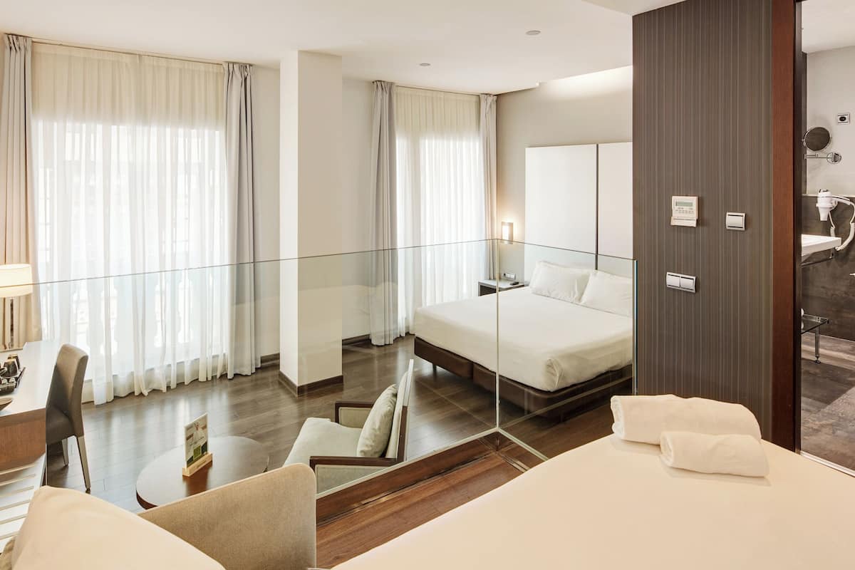 Classic Triple Room (with Double Bed) | Minibar, in-room safe, desk, blackout drapes