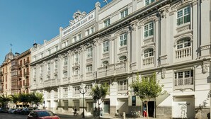 A historic building with a sign reading 'Sercotel' and a visible entrance. - Hotel Sercotel Coliseo (Bilbao)