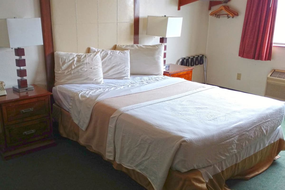 Meja kerja, tempat tidur lipat/tambahan, Wi-Fi gratis, dan jam alarm