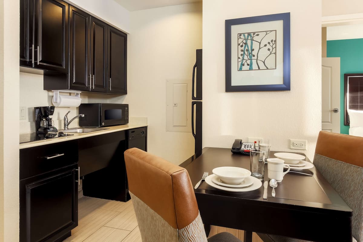 full-sized fridge, microwave, stovetop, dishwasher