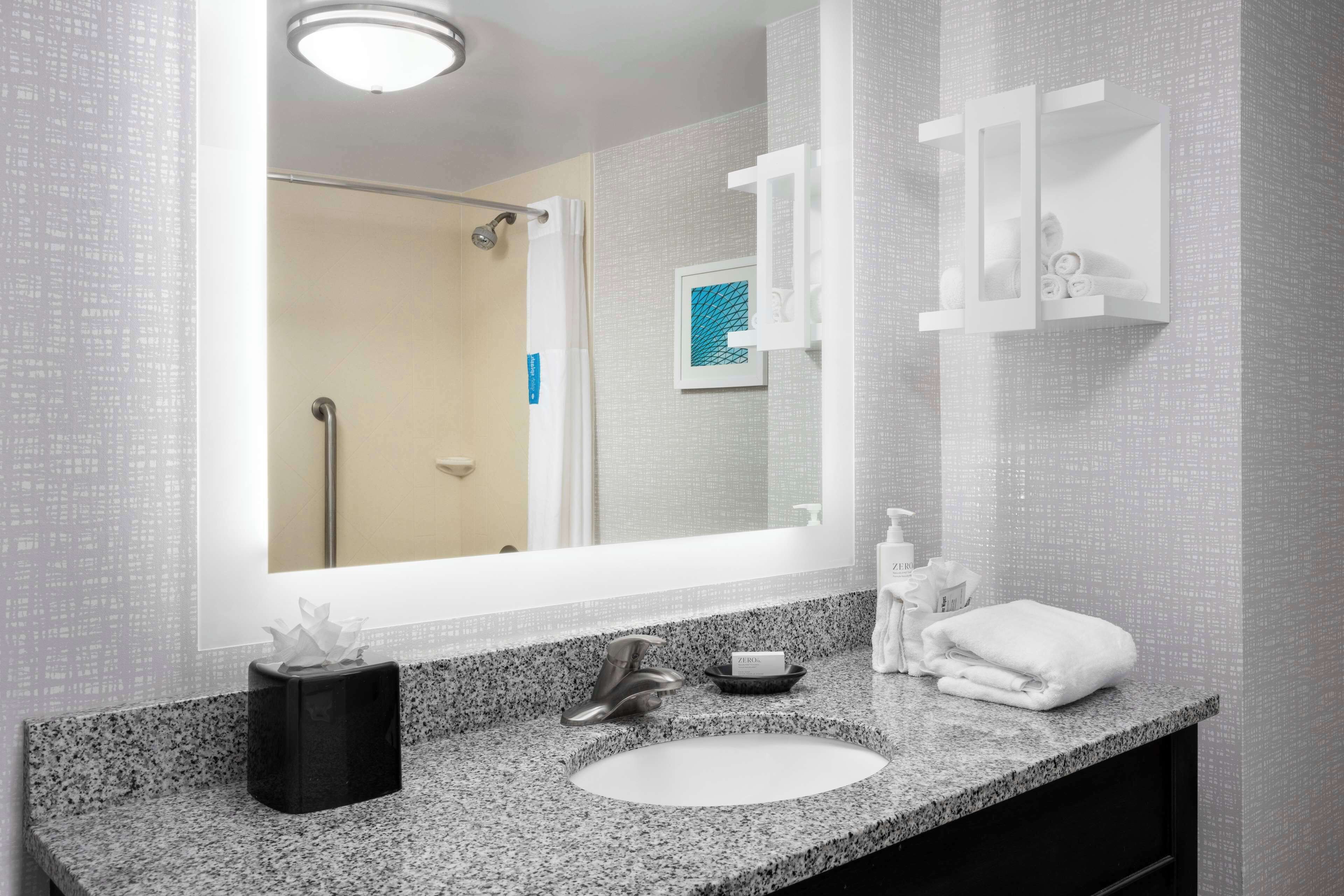 two queens | bathroom | combined shower/bathtub, designer toiletries, hair dryer, towels