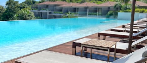 Outdoor pool, pool umbrellas, sun loungers