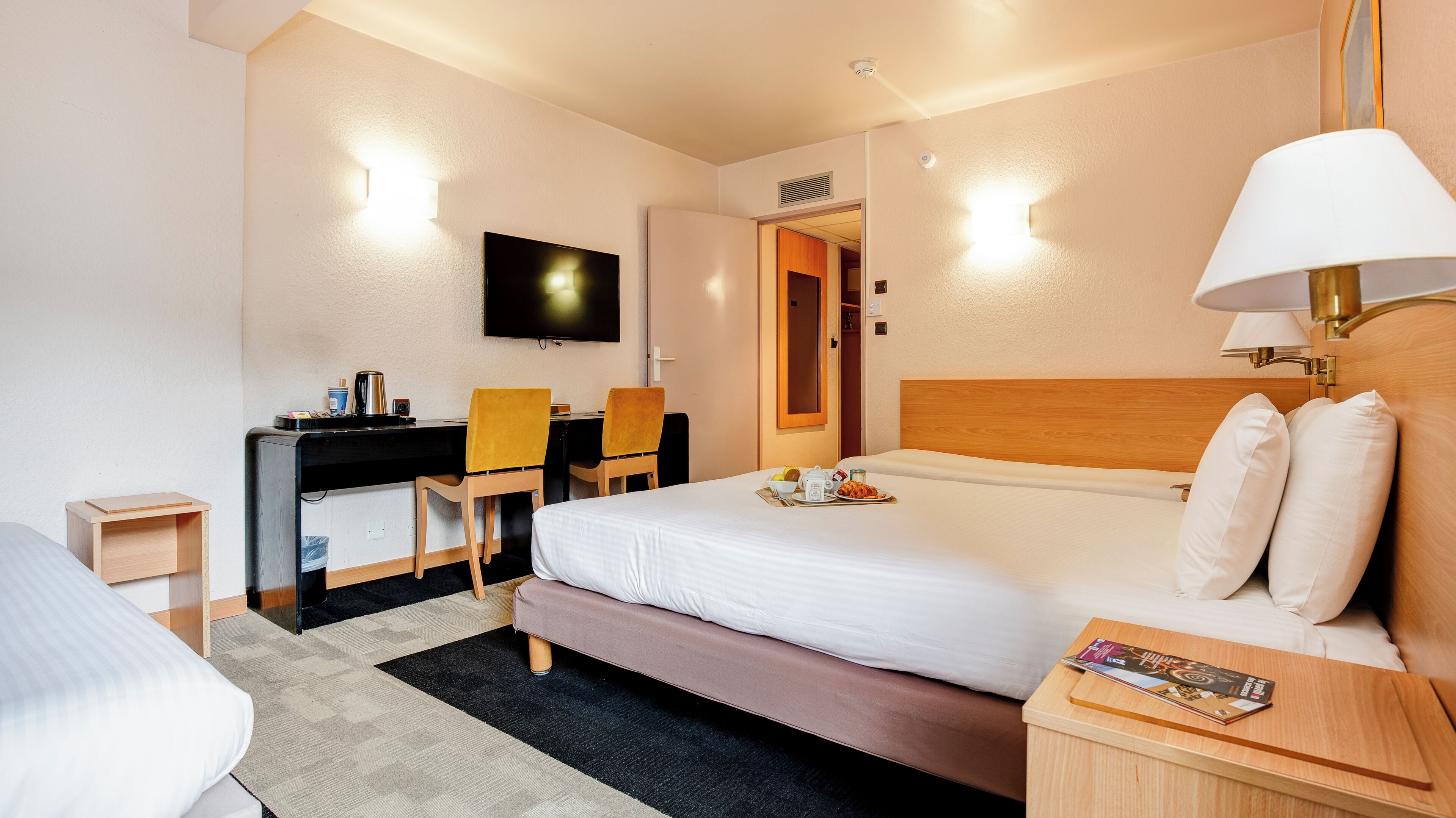 standard room, multiple beds | desk, blackout curtains, soundproofing, iron/ironing board