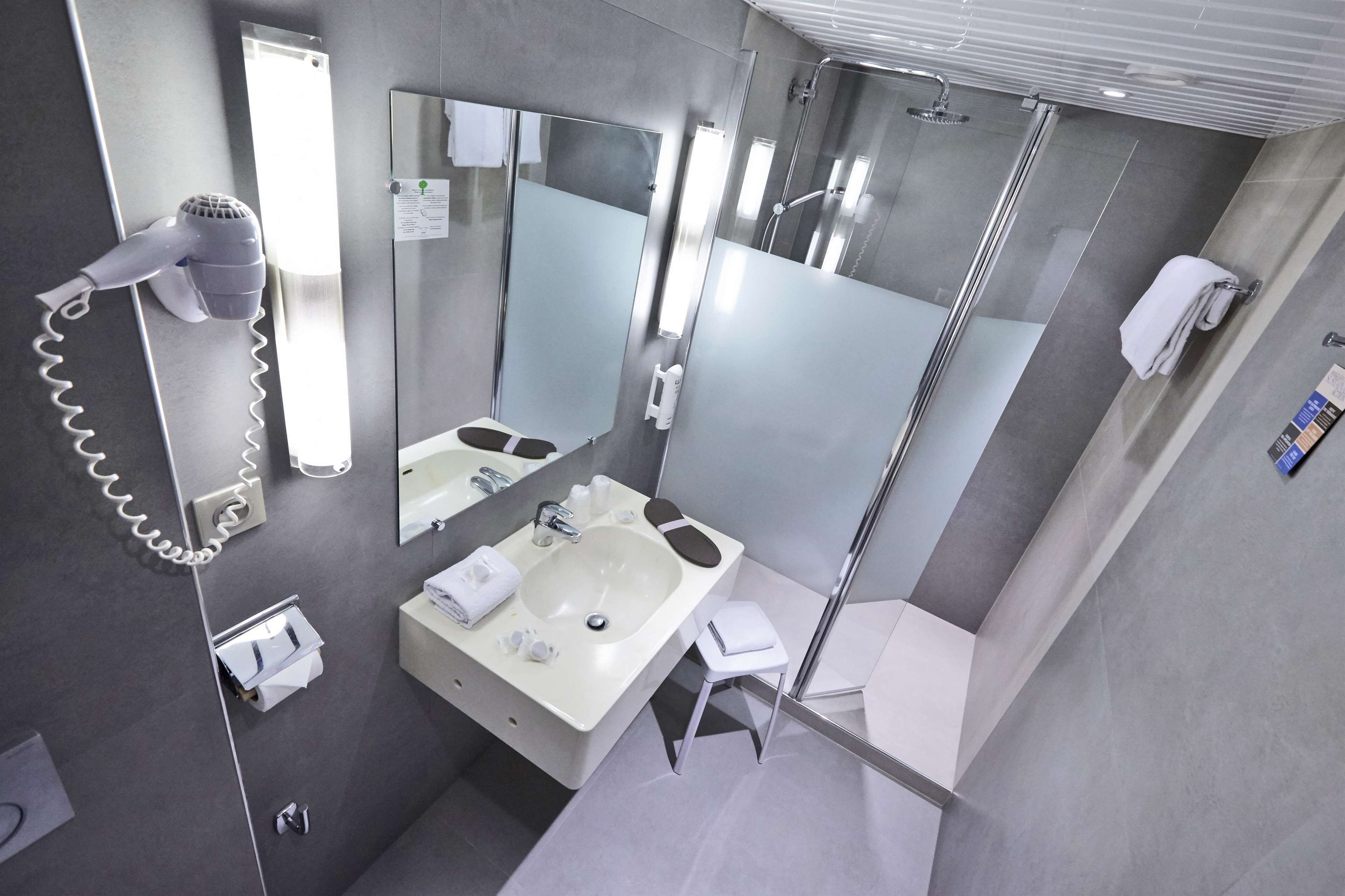 superior room, 1 double bed | bathroom | rainfall showerhead, eco-friendly toiletries, hair dryer, towels