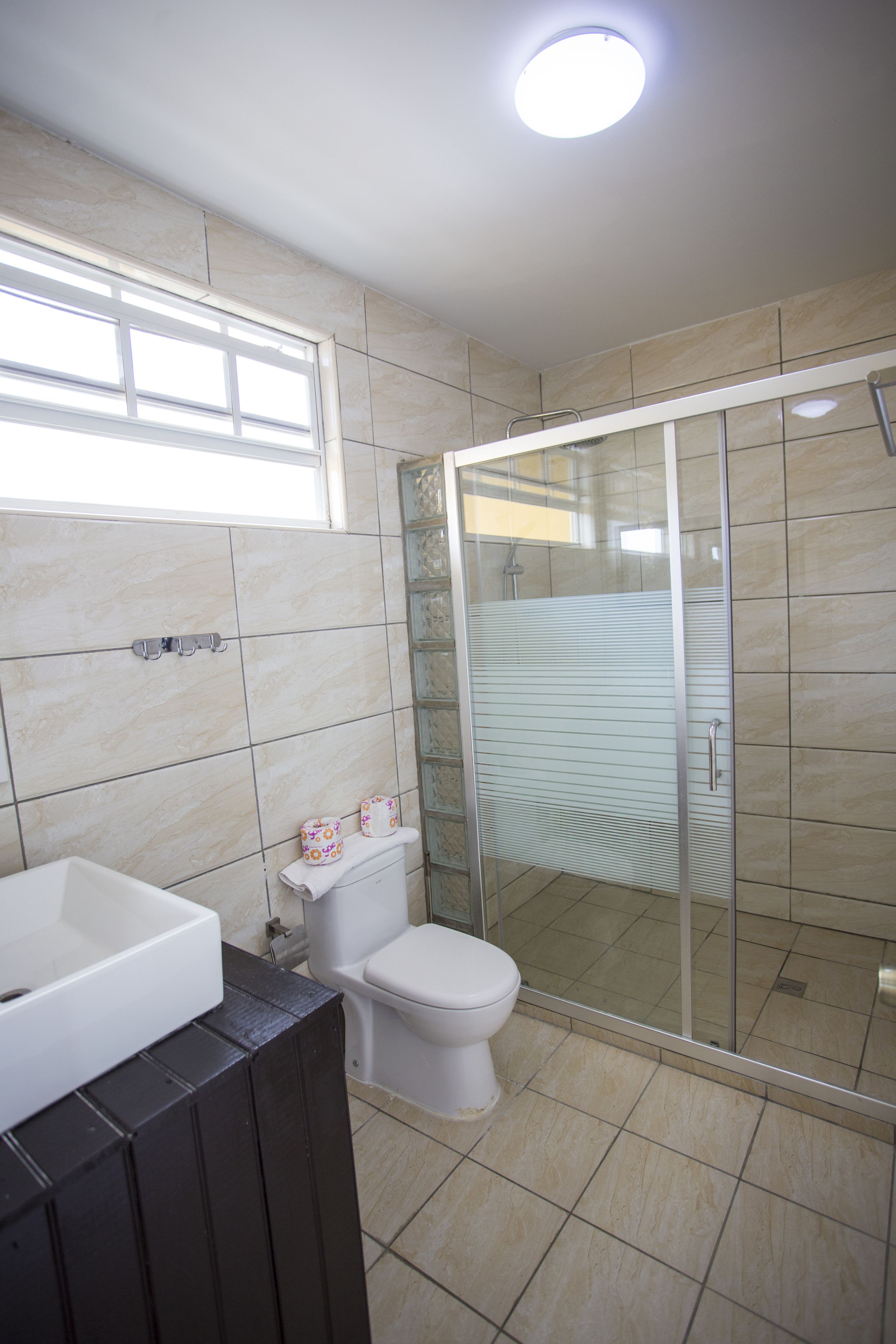 deluxe studio | bathroom | shower, towels