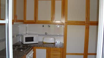 Apartment, 1 Bedroom | Private kitchen | Full-size fridge, microwave, stovetop, coffee/tea maker