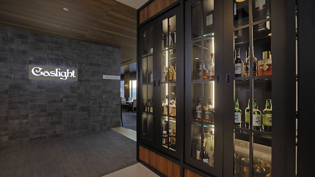 A modern interior with a stone wall and a sign reading "Caslight Restaurant." - Aizuwakamatsu Washington Hotel (Aizuwakamatsu)