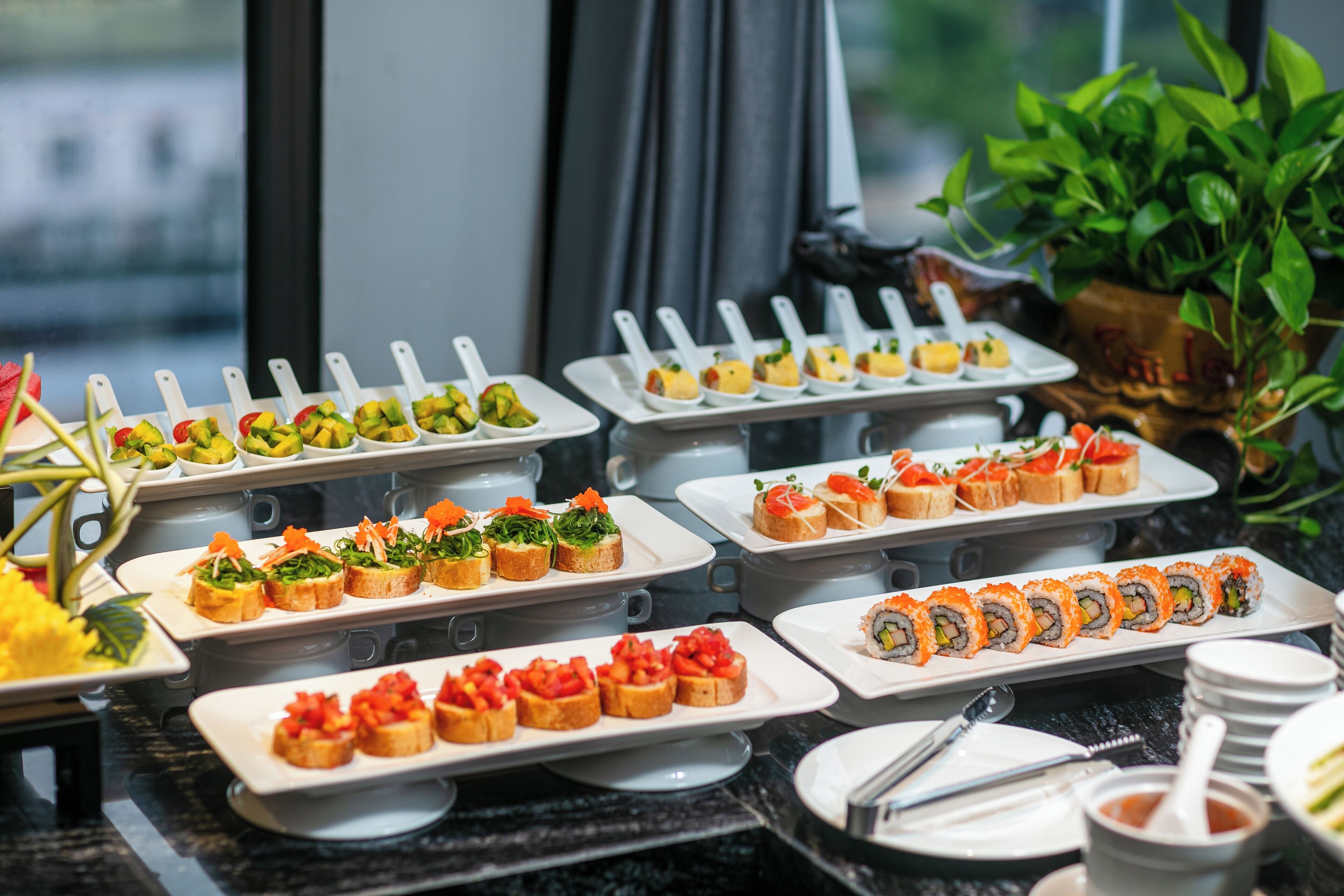 A buffet with various dishes including sushi, salads, and appetizers.