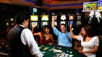 Experience the excitement of our casino, where you can play blackjack and enjoy a variety of slot machines.