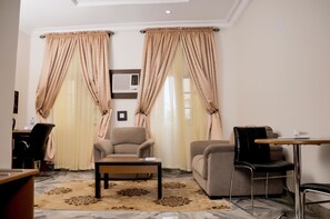 Apartment, 1 Bedroom (Ogugua) | Living area | 32-inch LCD TV with satellite channels, TV