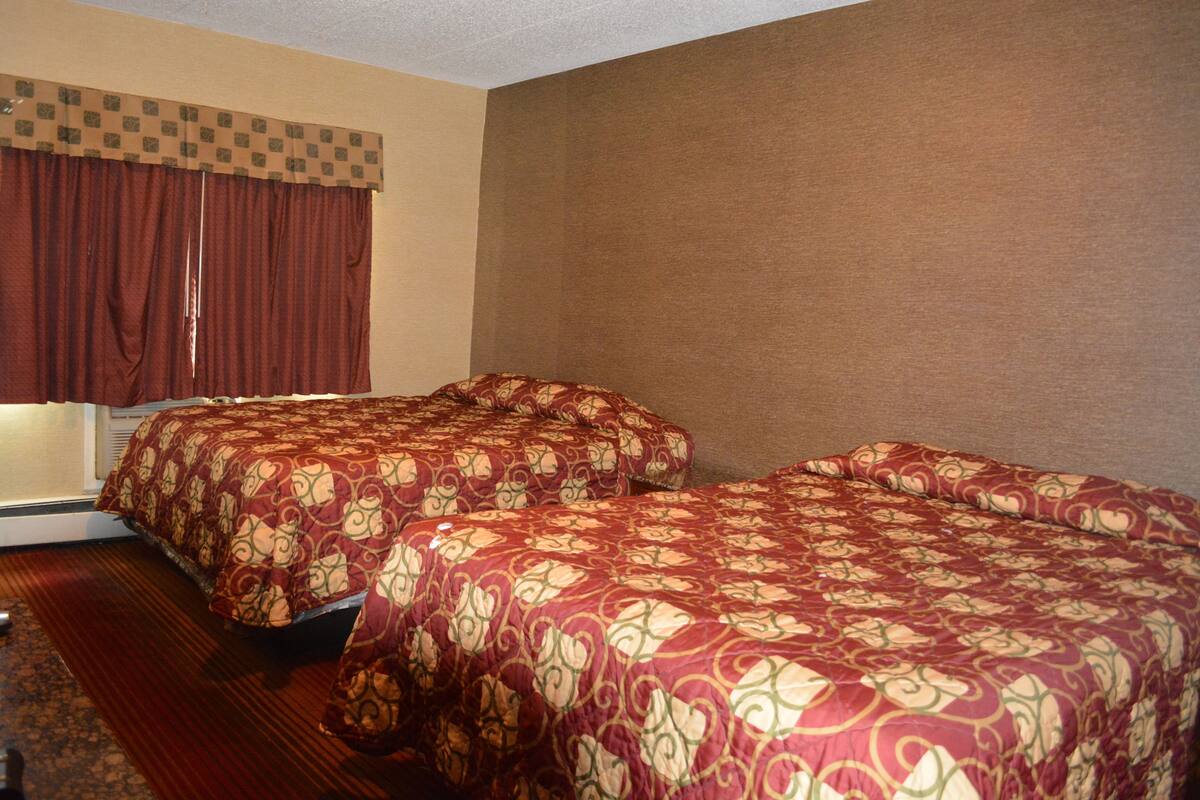 Premium bedding, pillow-top beds, desk, blackout curtains
