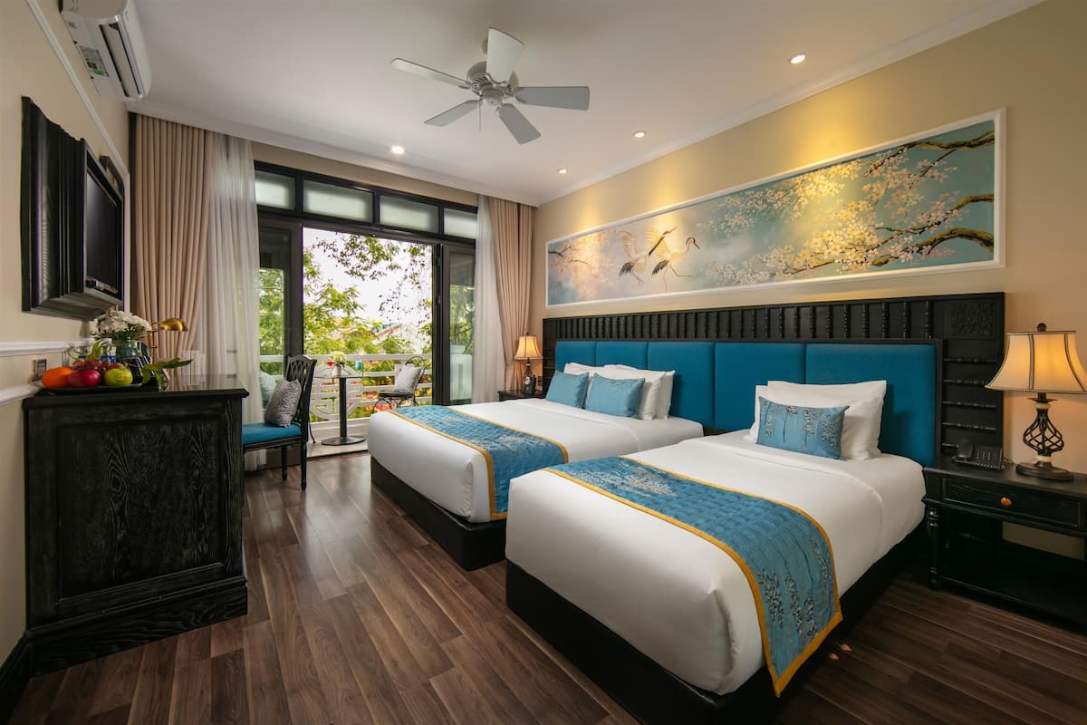 Deluxe Triple Room, City View | Premium bedding, in-room safe, desk, blackout curtains